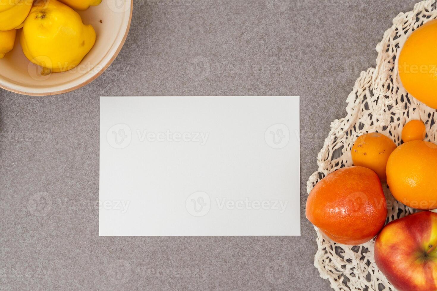 Card and White Paper Mockup Harmonized with Fresh Fruit, Crafting a Visual Symphony of Artful Design and Culinary Delight, Where Wholesome Ingredients Merge in a Feast of Vibrant Imagery photo