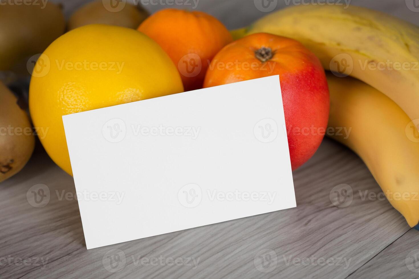 Card and White Paper Mockup Harmonized with Fresh Fruit, Crafting a Visual Symphony of Artful Design and Culinary Delight, Where Wholesome Ingredients Merge in a Feast of Vibrant Imagery photo