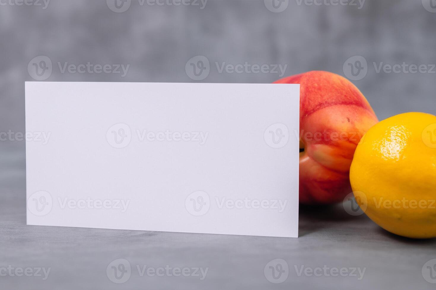 Card and White Paper Mockup Harmonized with Fresh Fruit, Crafting a Visual Symphony of Artful Design and Culinary Delight, Where Wholesome Ingredients Merge in a Feast of Vibrant Imagery photo