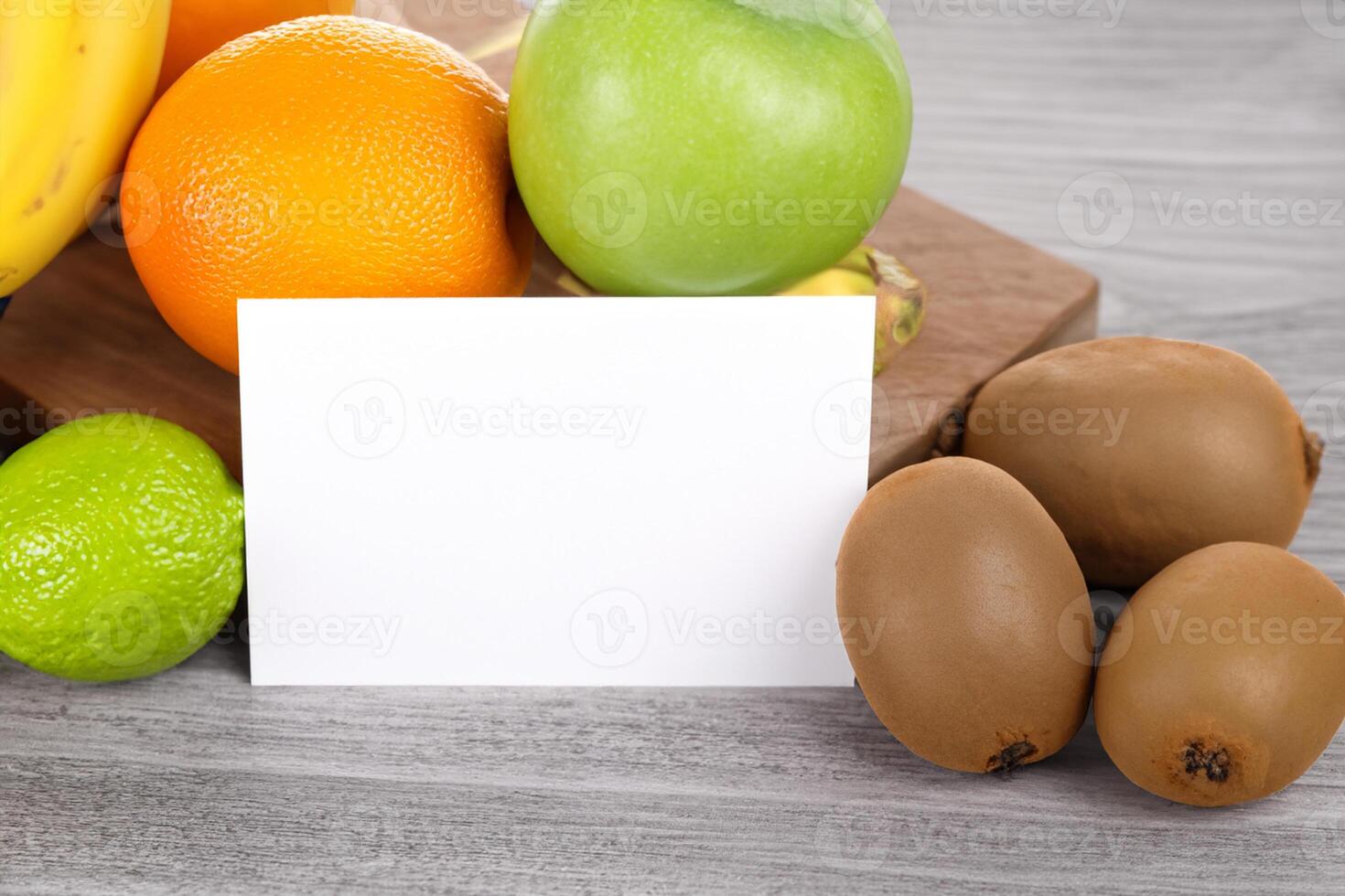 Card and White Paper Mockup Harmonized with Fresh Fruit, Crafting a Visual Symphony of Artful Design and Culinary Delight, Where Wholesome Ingredients Merge in a Feast of Vibrant Imagery photo