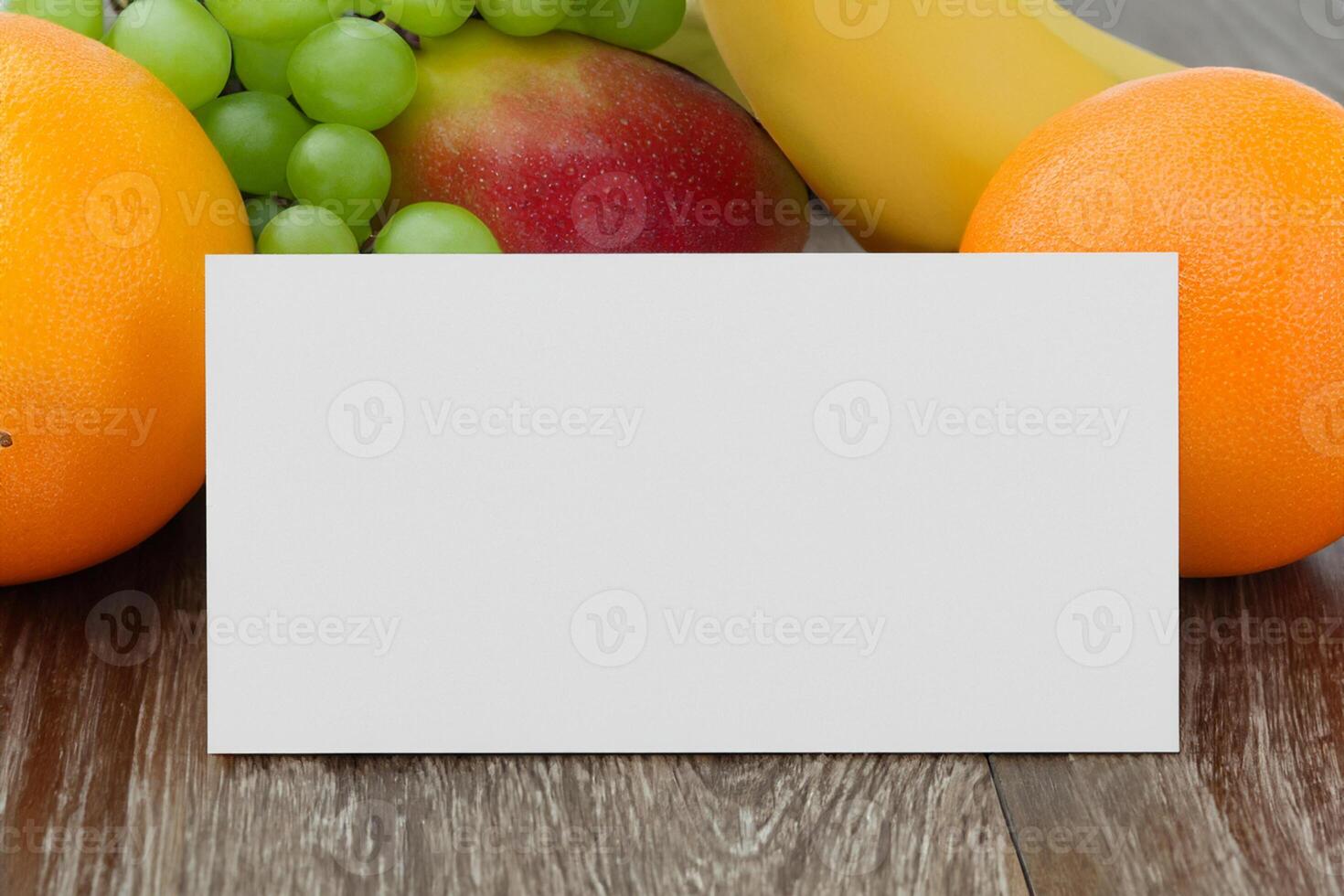 Card and White Paper Mockup Harmonized with Fresh Fruit, Crafting a Visual Symphony of Artful Design and Culinary Delight, Where Wholesome Ingredients Merge in a Feast of Vibrant Imagery photo