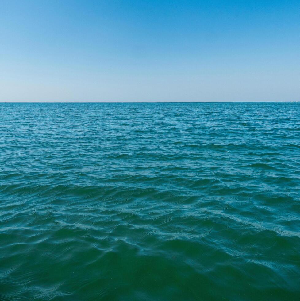 Landscape beautiful summer vertical horizon look view tropical shore open sea beach cloud clean and blue sky background calm nature ocean wave water nobody travel at thailand chonburi sun day time photo