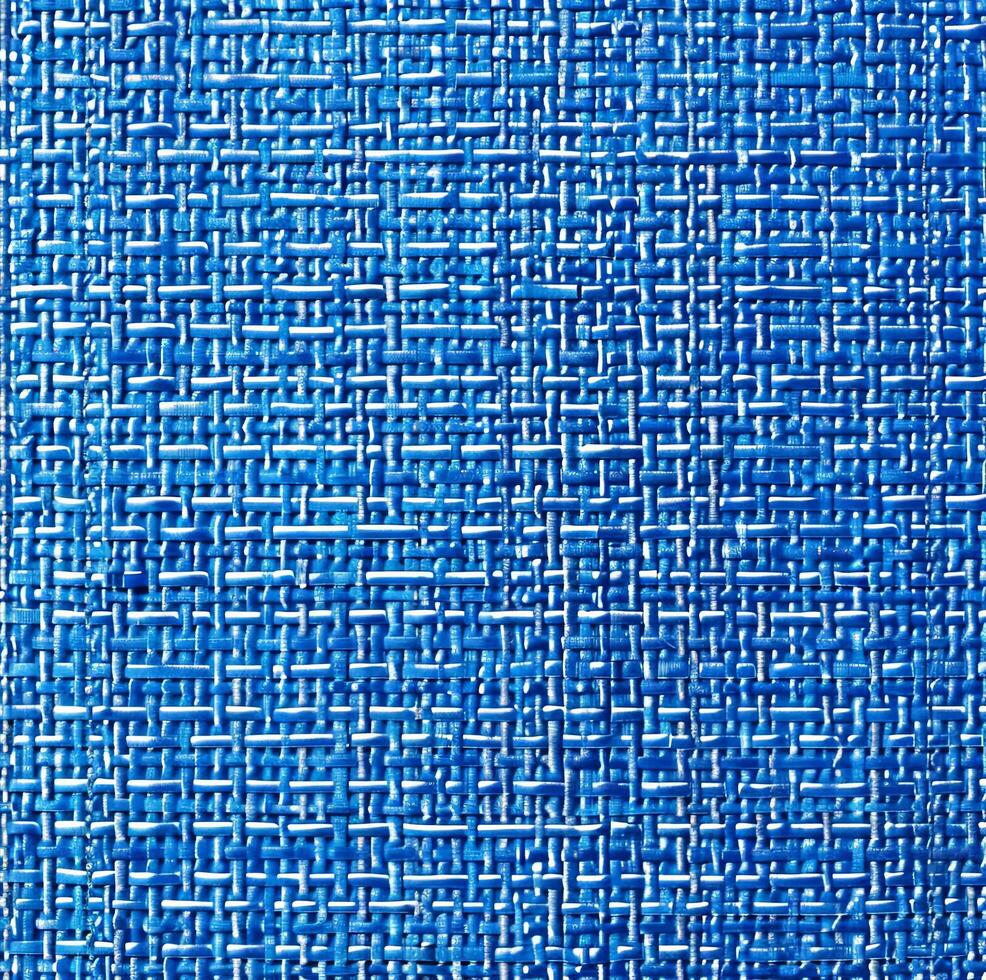 un azul y blanco tejido tela con un azul antecedentes foto