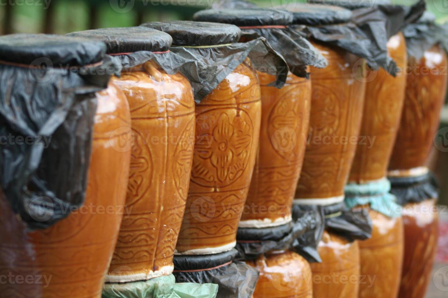 brewing rice wine in a tribal village in Cambodia photo