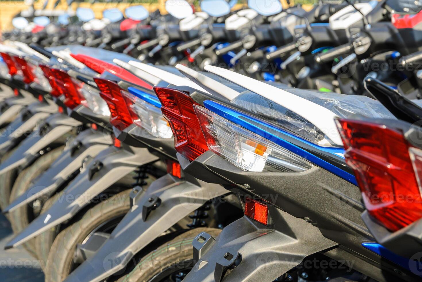 New motorcycles parked in a row on the sidewalk, transportation background photo