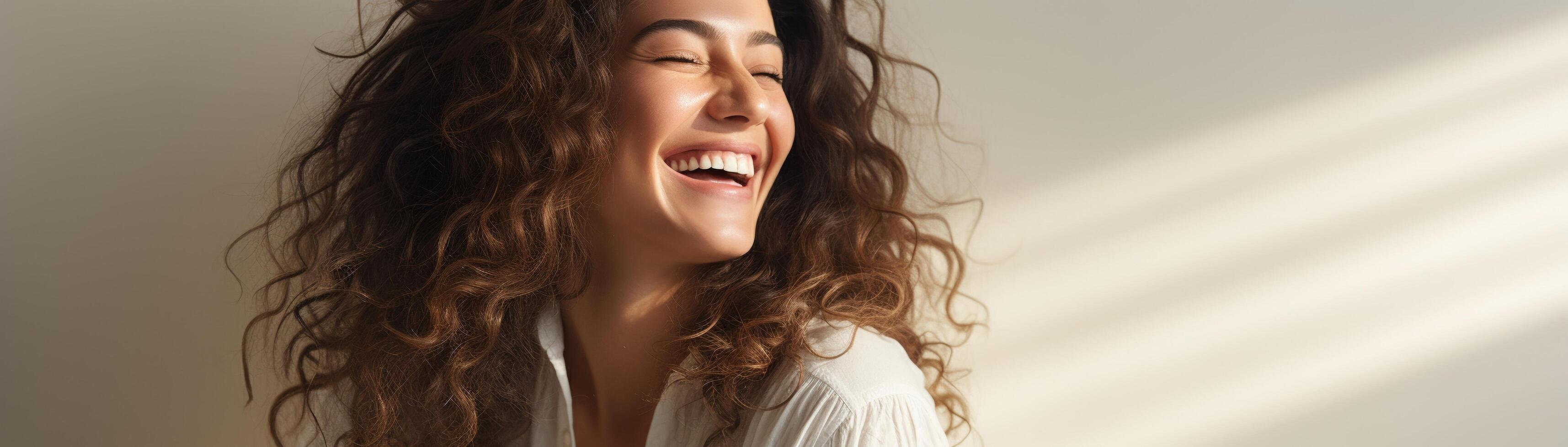 Happy woman, neutral studio setting, natural pose, bright ambiance, right margin for copy photo