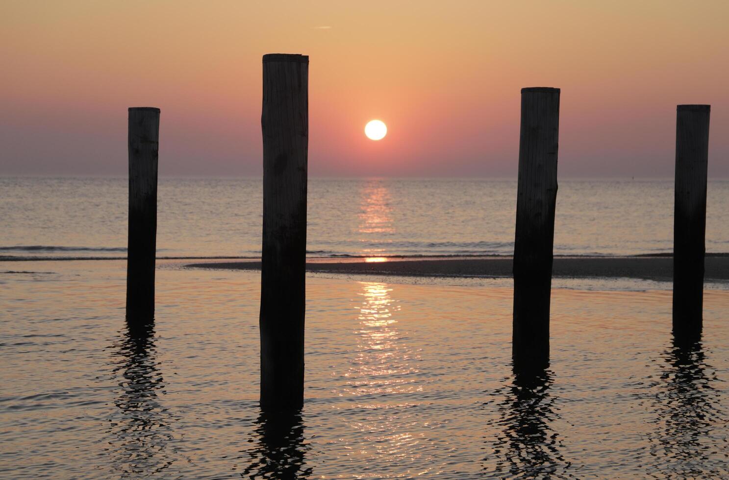 sunset in the pole village of Petten in the Netherlands photo