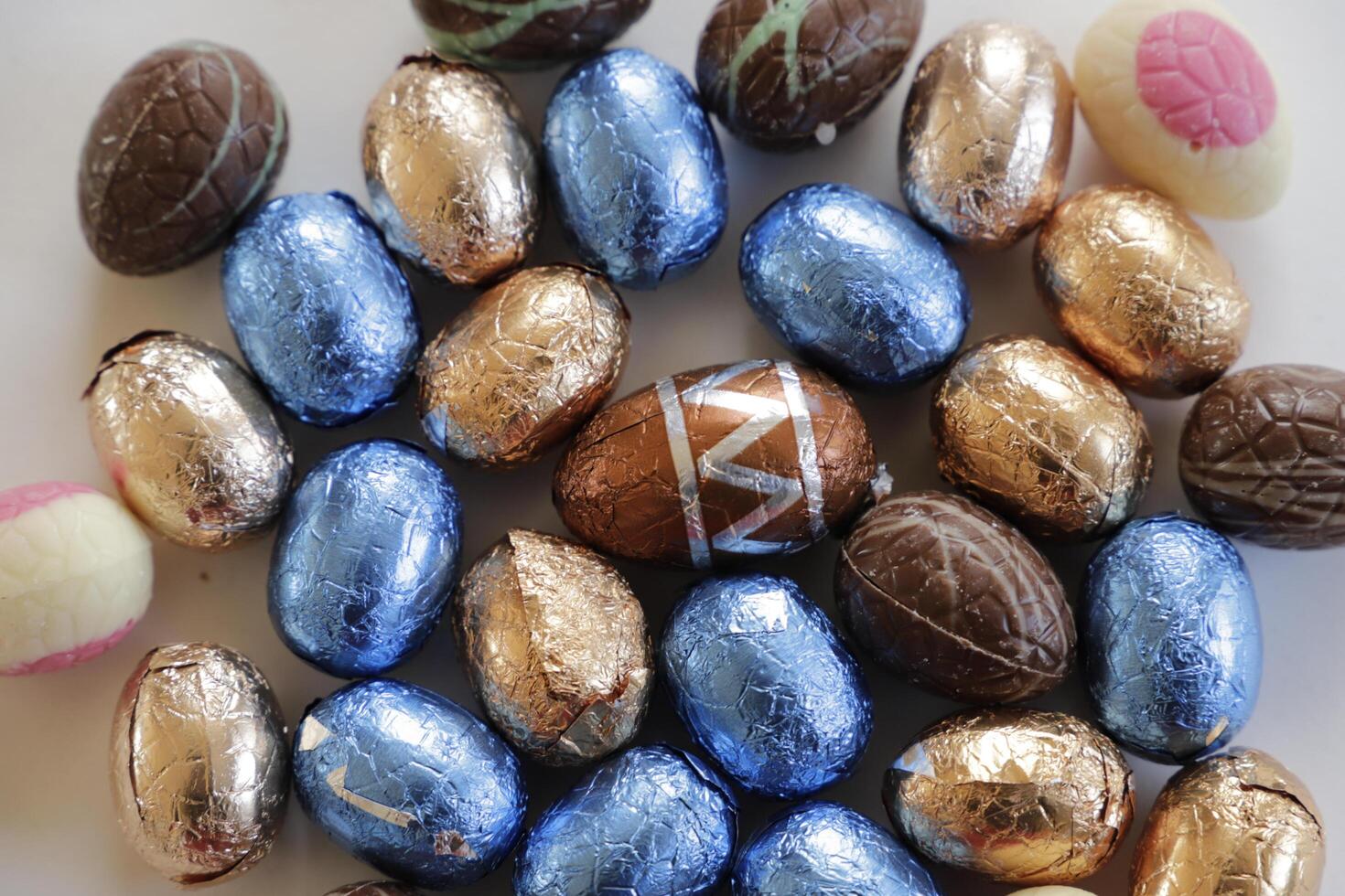 easter chocolate eggs colorful wrapped in foil photo