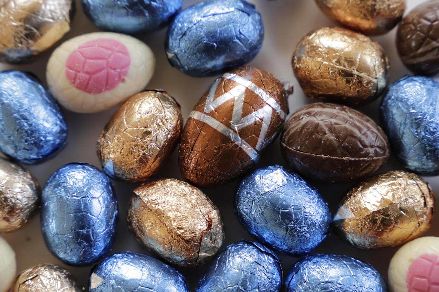 easter chocolate eggs colorful wrapped in foil photo