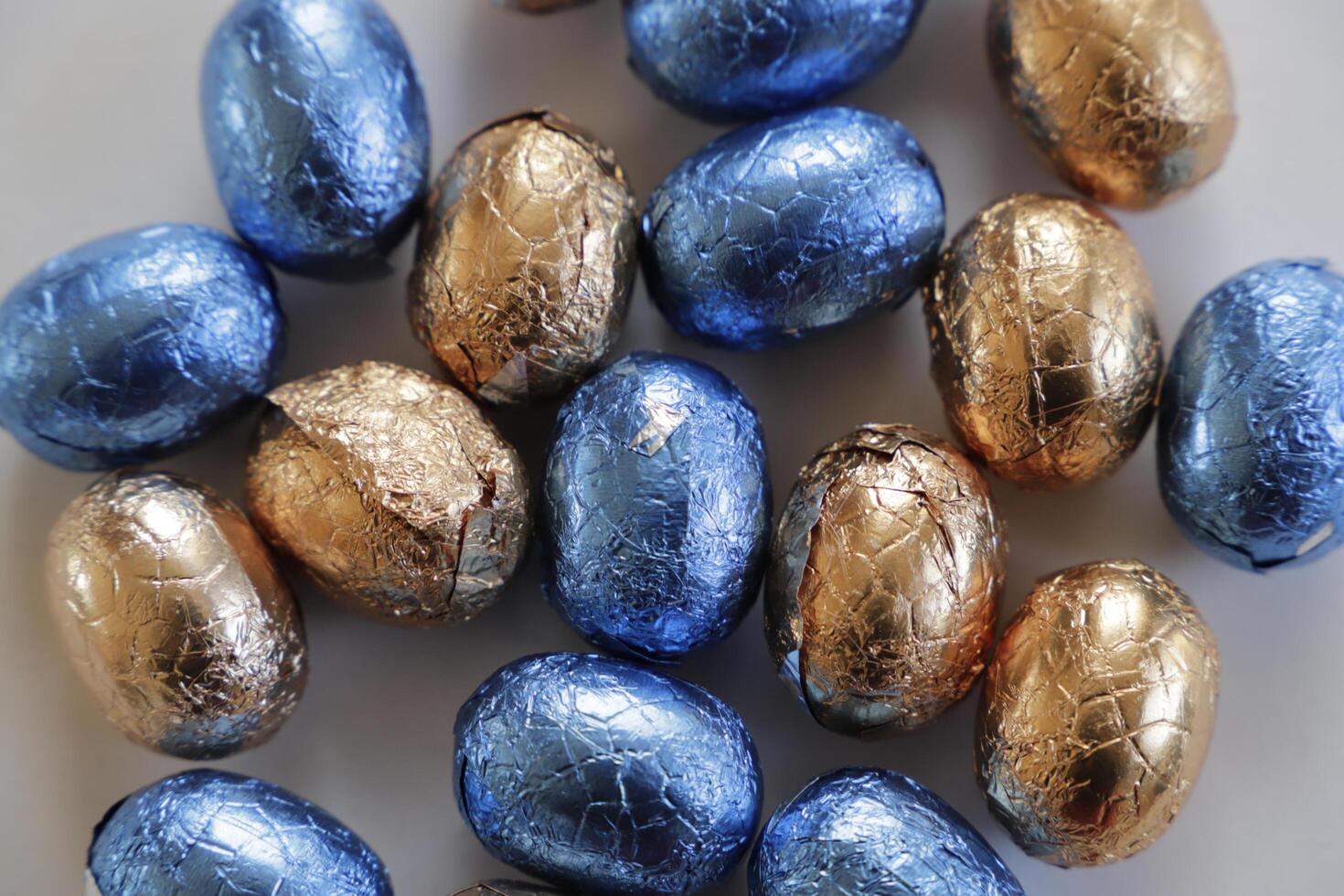 easter chocolate eggs colorful wrapped in foil photo