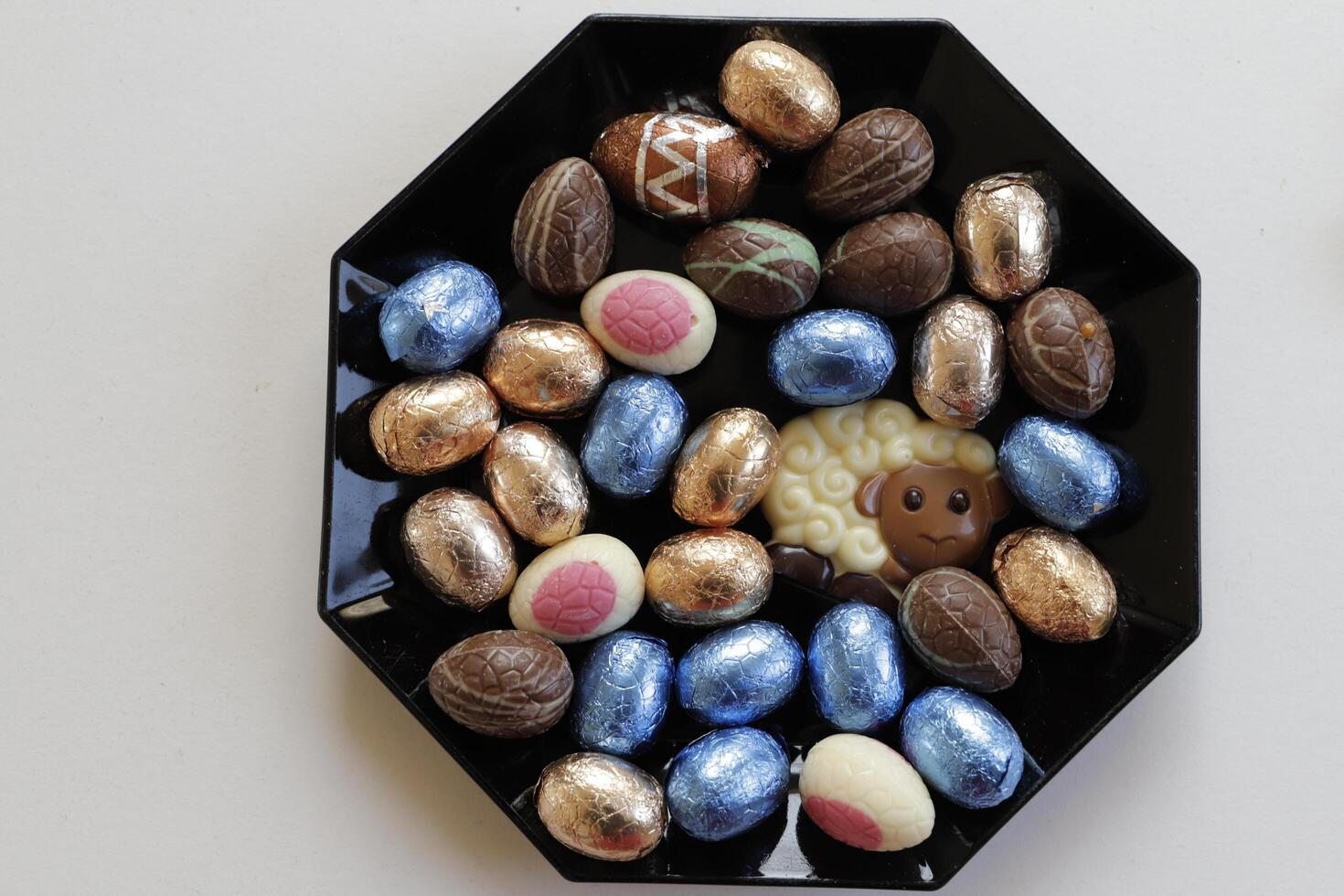 easter chocolate eggs colorful wrapped in foil photo