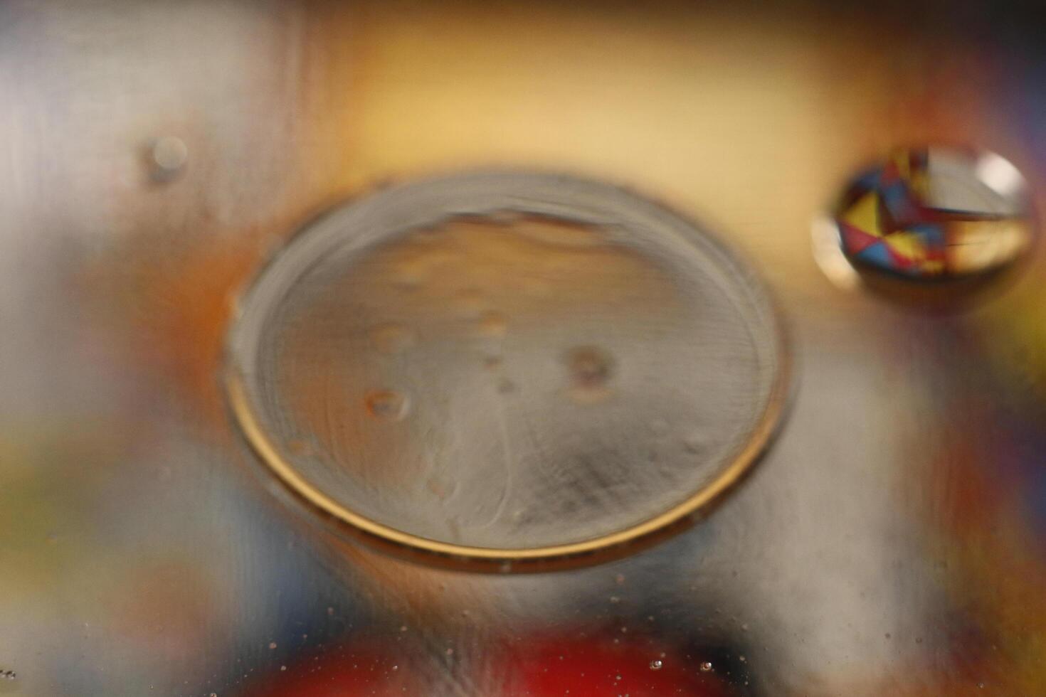 creative photography, oil drops on water with colors photo