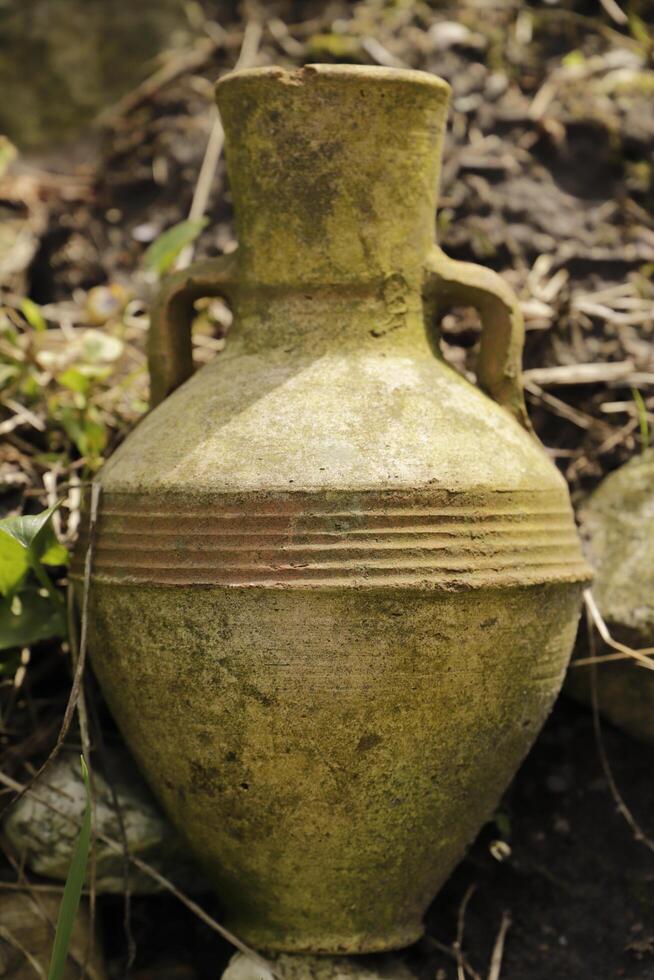 earthenware jug in garden photo