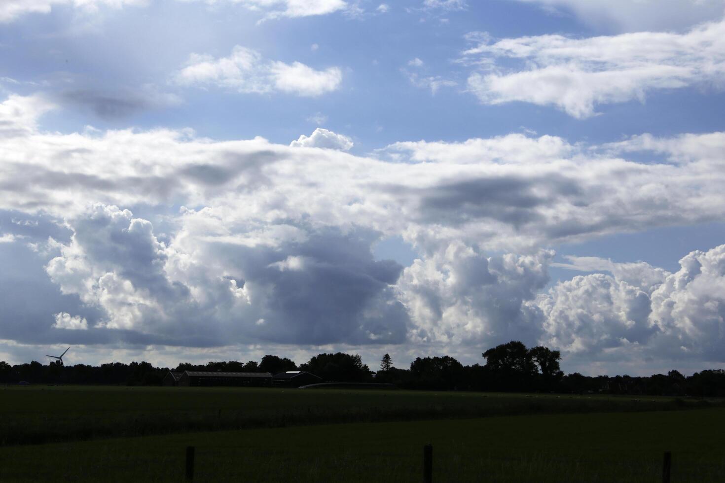 dramatic clouds in a dutch landscape photo