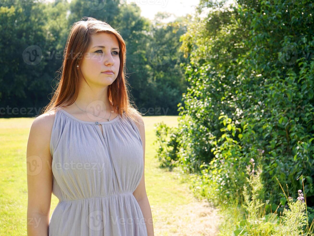 young woman in a park photo