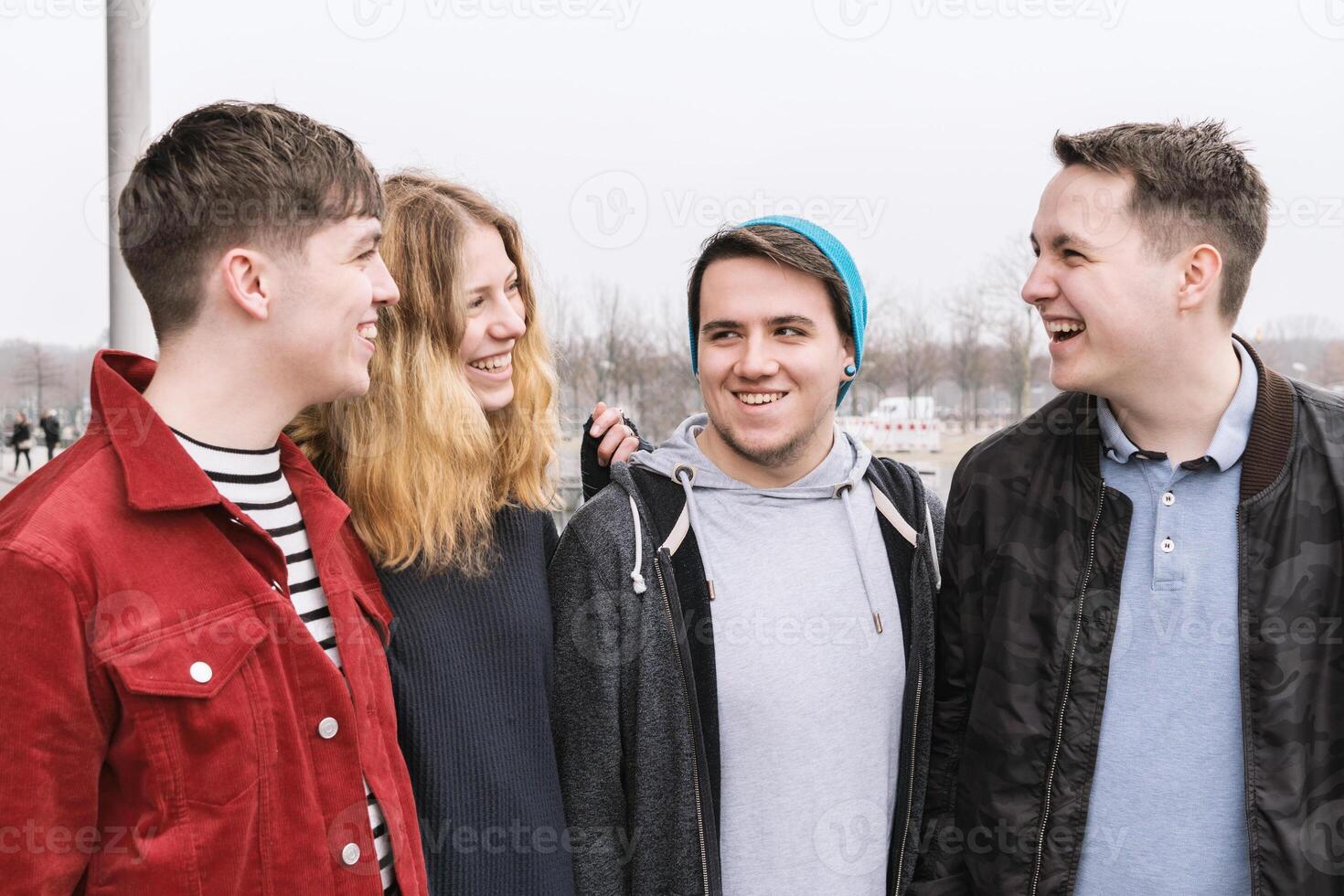 group of young friends having fun and laughing together photo