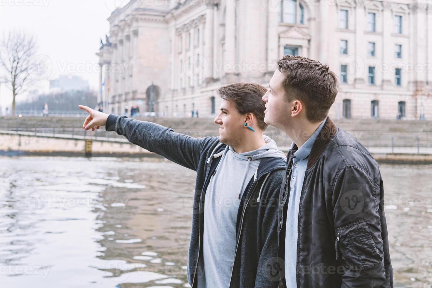 two male tourists exploring government district in Berlin Germany photo