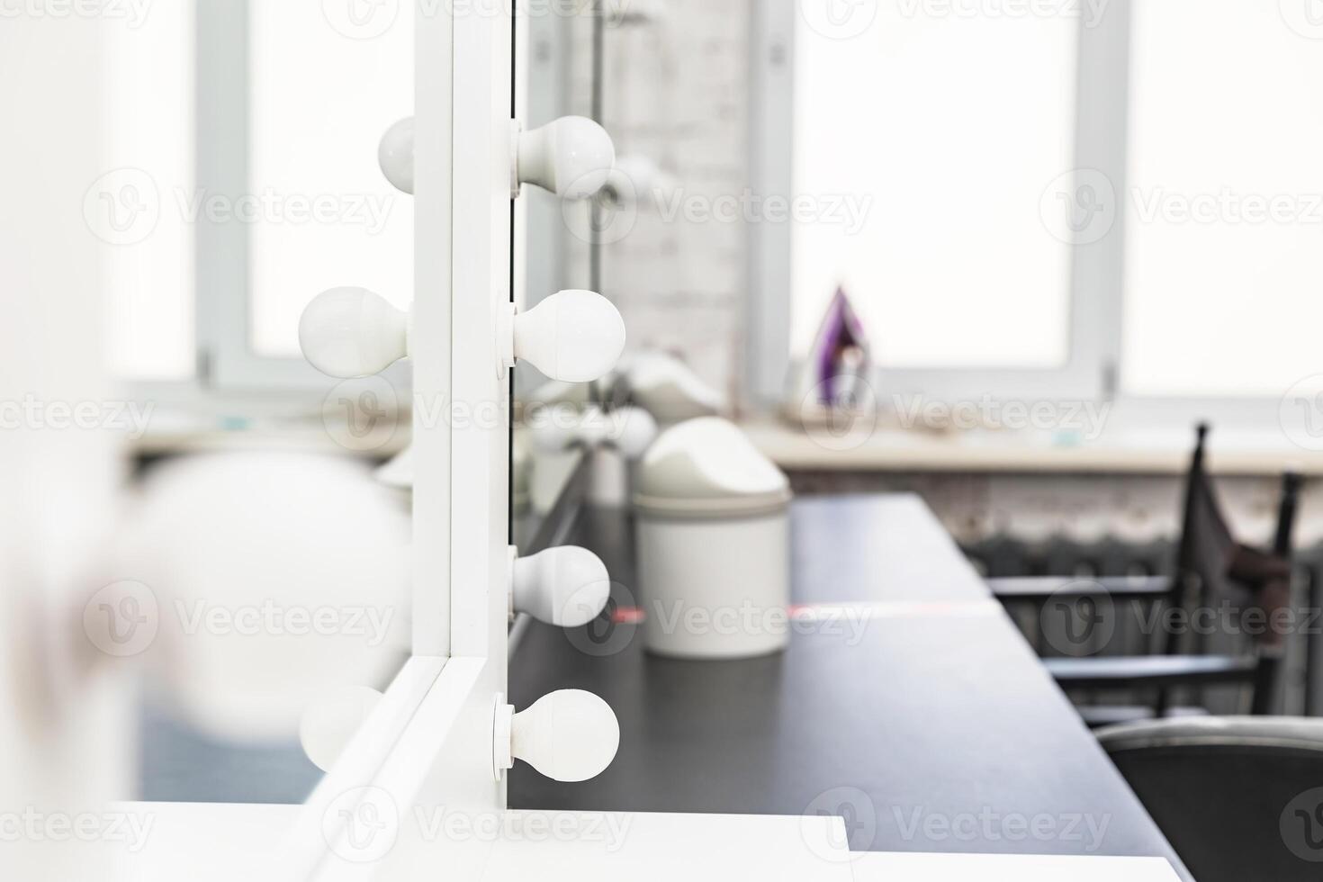 Mirrors with bulbs for make up in the make-up room photo