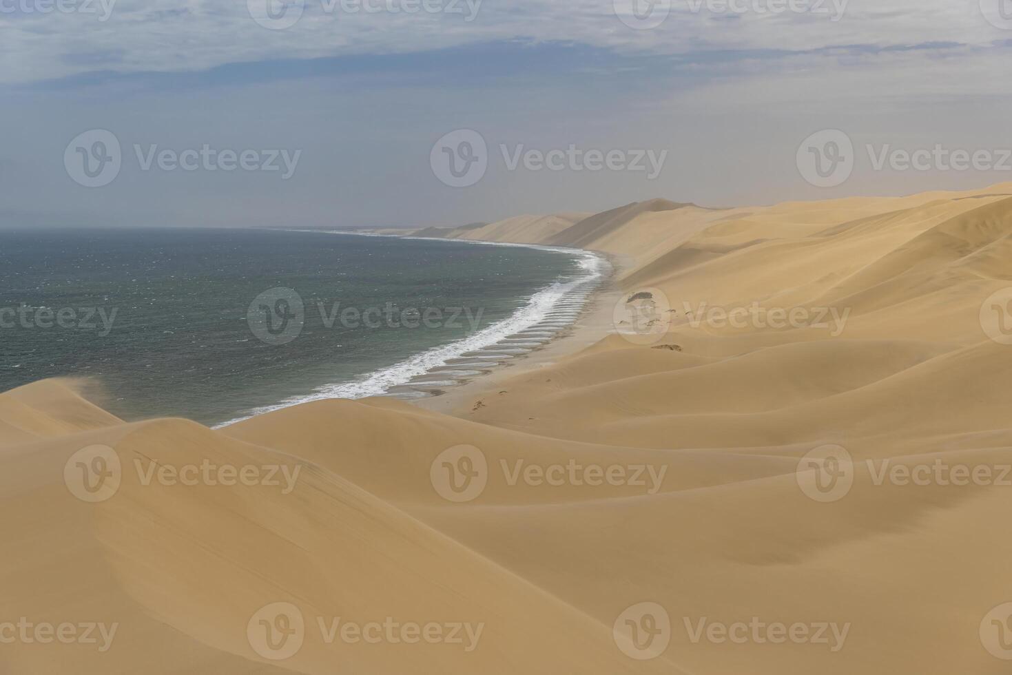 Picture of the dunes of Sandwich Harbor in Namibia on the Atlantic coast during the day photo