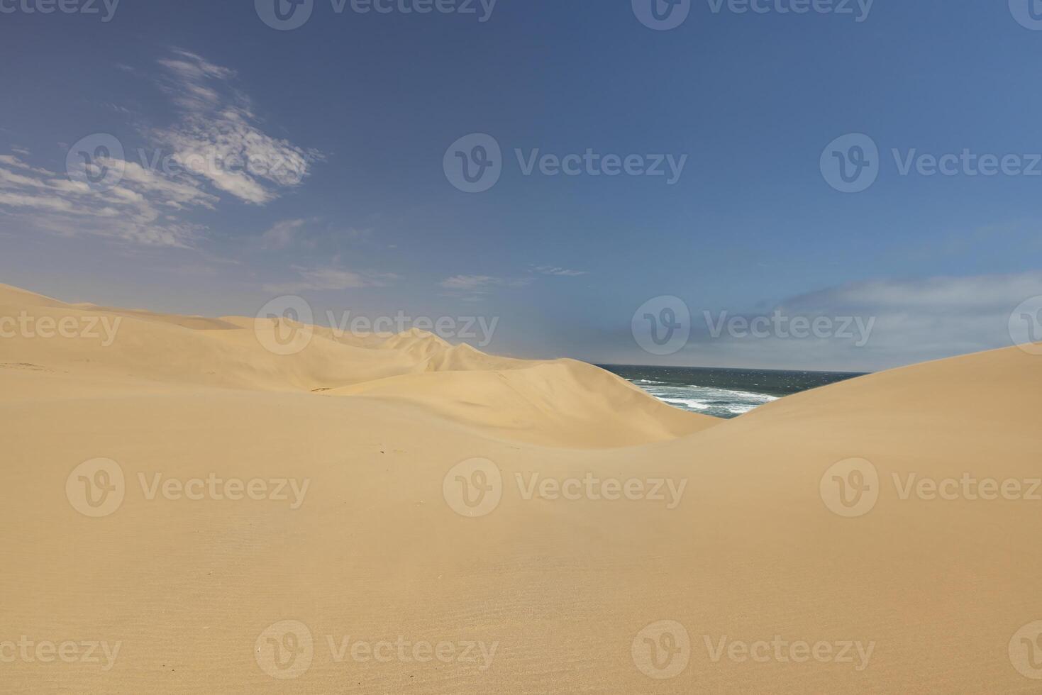 Picture of the dunes of Sandwich Harbor in Namibia on the Atlantic coast during the day photo