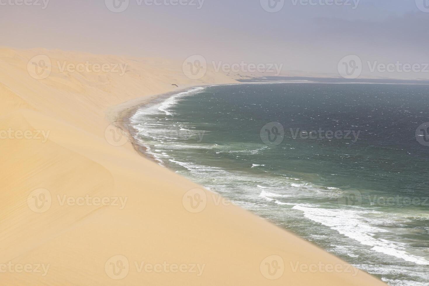 Picture of the dunes of Sandwich Harbor in Namibia on the Atlantic coast during the day photo