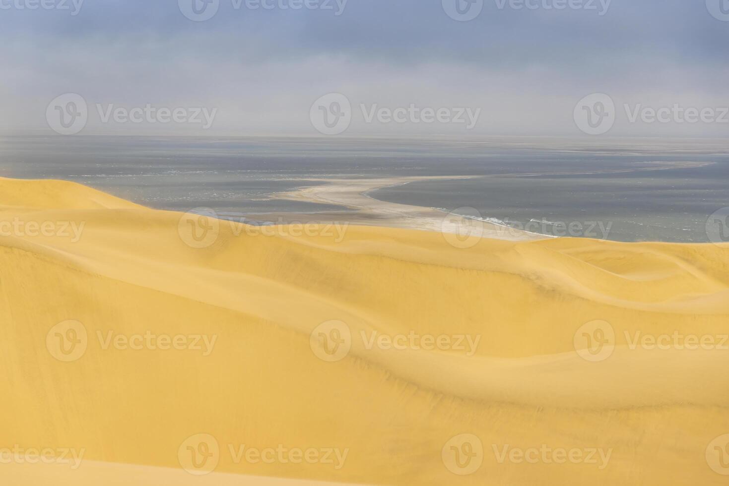 Picture of the dunes of Sandwich Harbor in Namibia on the Atlantic coast during the day photo