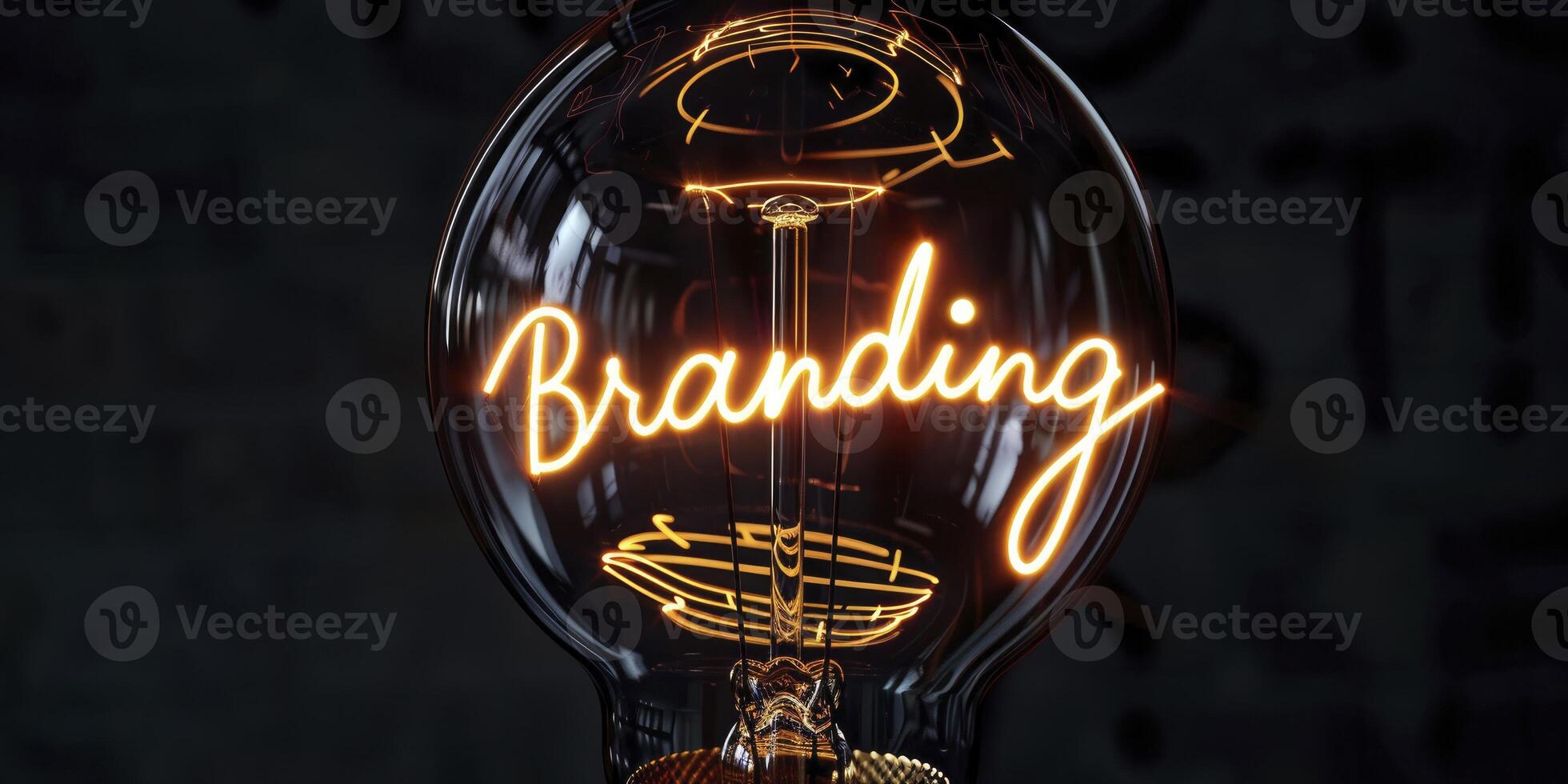 A light bulb with glowing wire forming the word Branding on a black background. photo