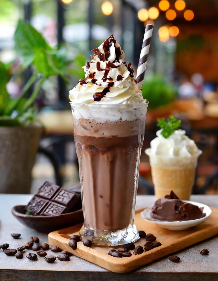 Chocolate milkshake with whipped cream and cafe background photo