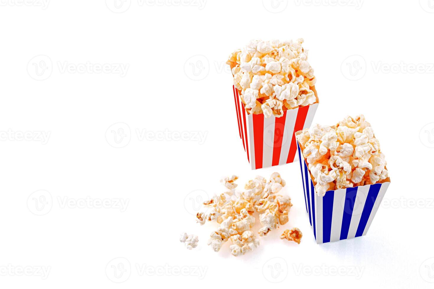 Glass with popcorn on a white background photo