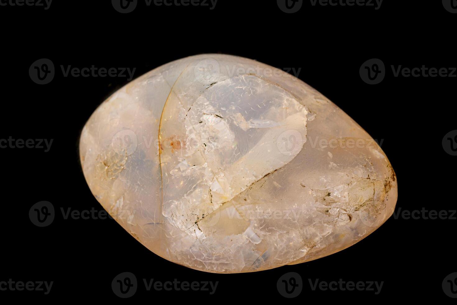 Macro stone opal mineral on a black background photo