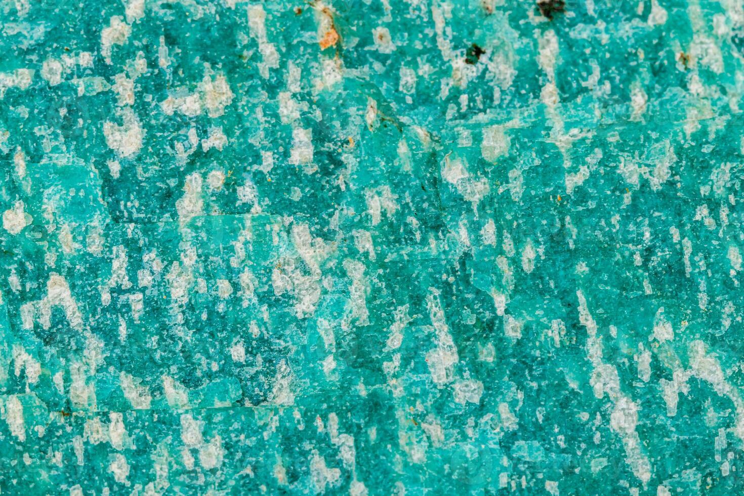 Macro of mineral stone amazonite on white background photo