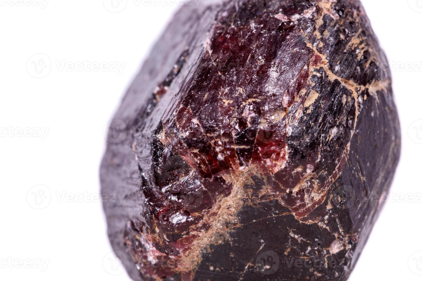 Macro of a mineral garnet stone on a white background photo
