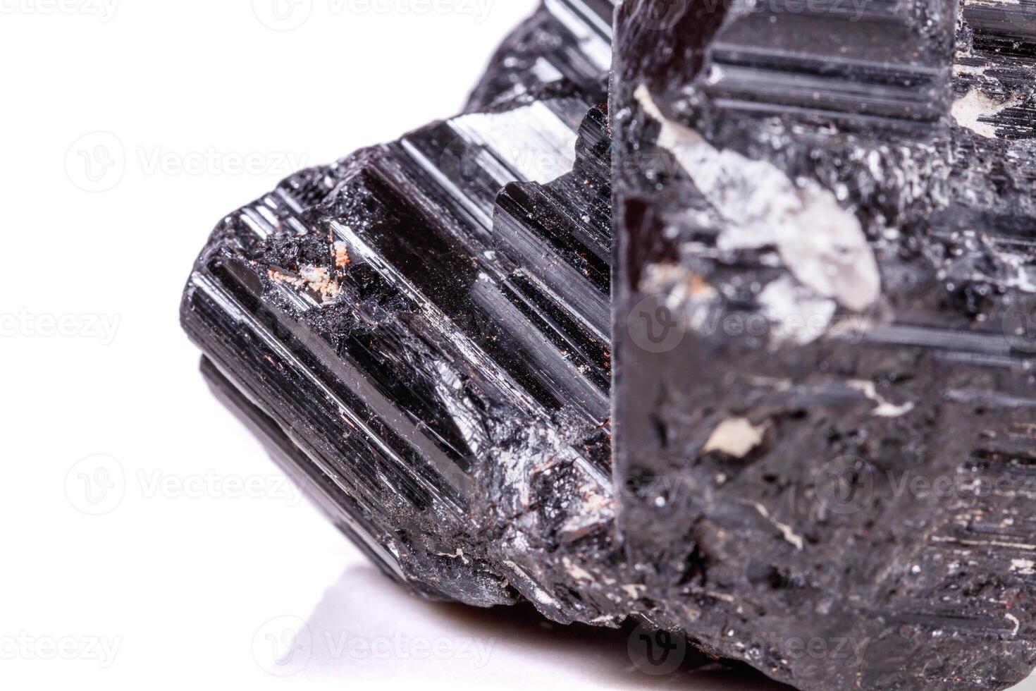 macro mineral stone sherle, schorl, black tourmaline on white background photo