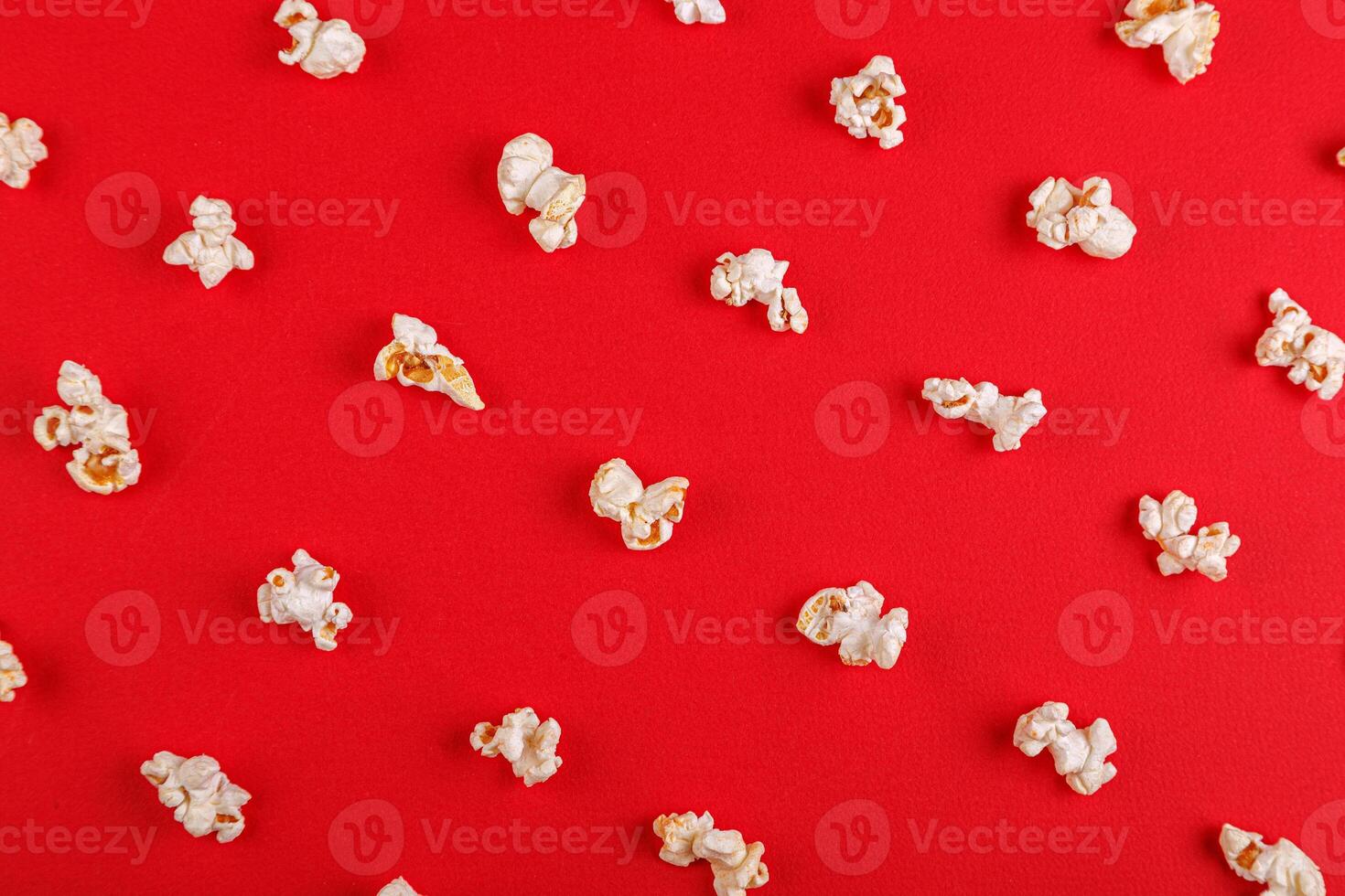 popcorn macro on a red background photo