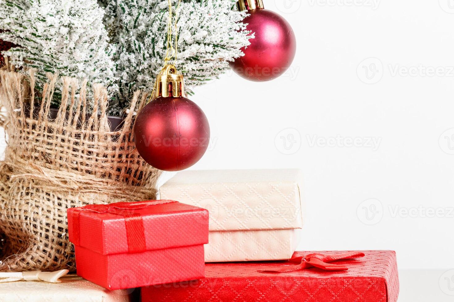 Christmas tree gift boxes with toys on a white background photo