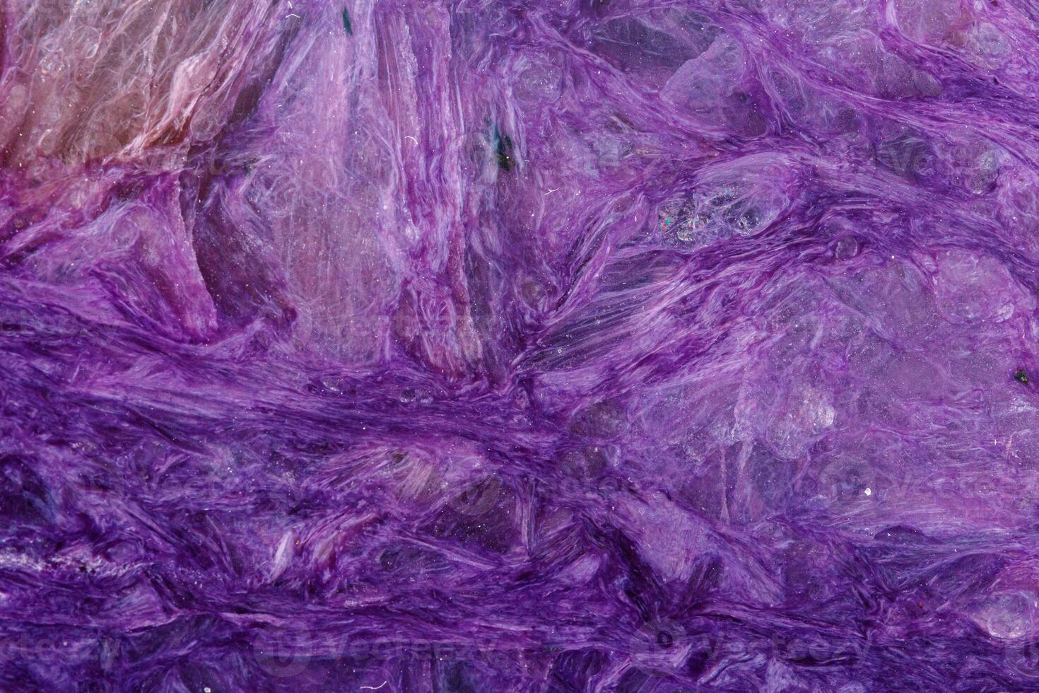 macro mineral stone Charoite on a white background photo