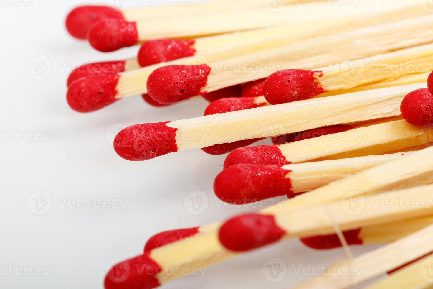 matches with a red head on a white background photo