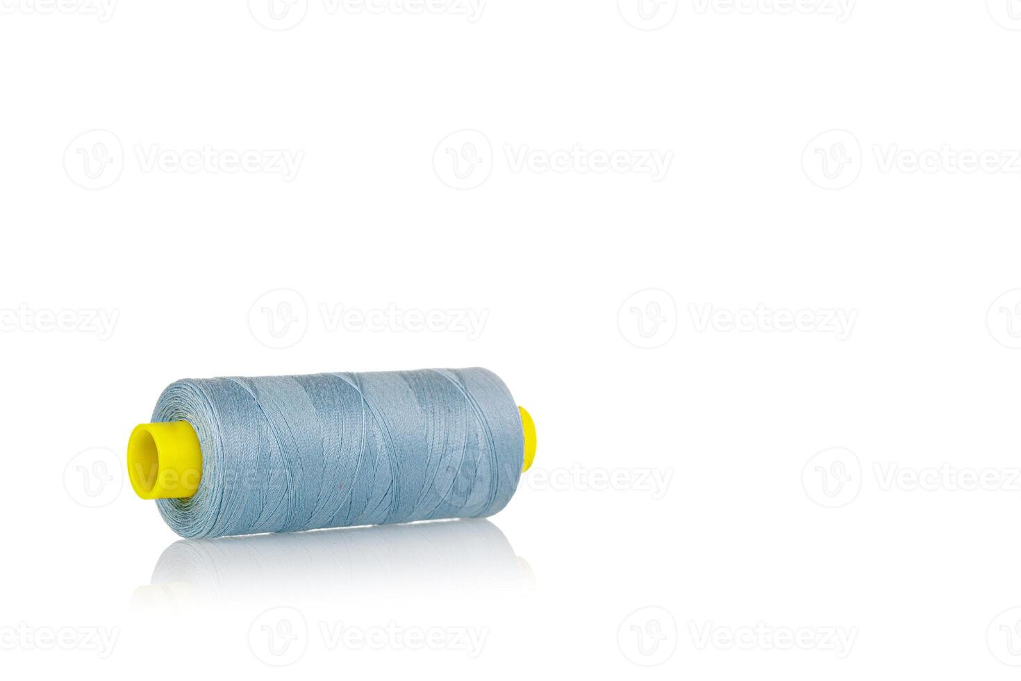 a skein of threads of blue color macro on a white background close up photo