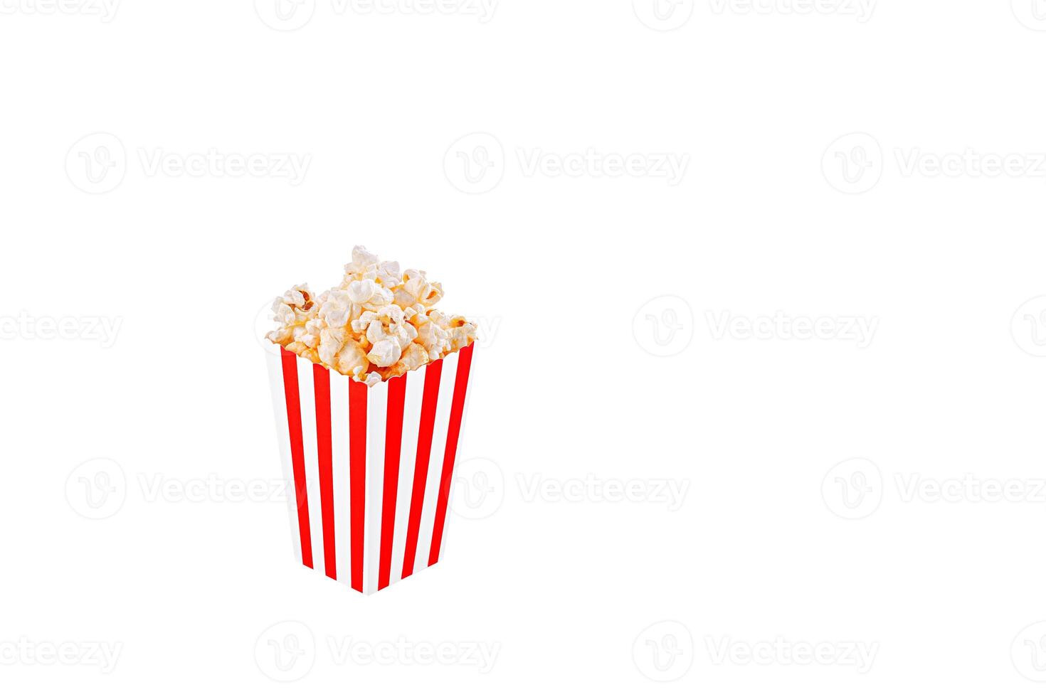 Glass with popcorn on a white background photo