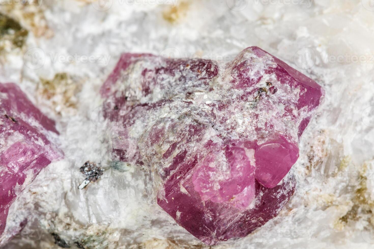 Macro mineral stone Ruby in rock on white background photo