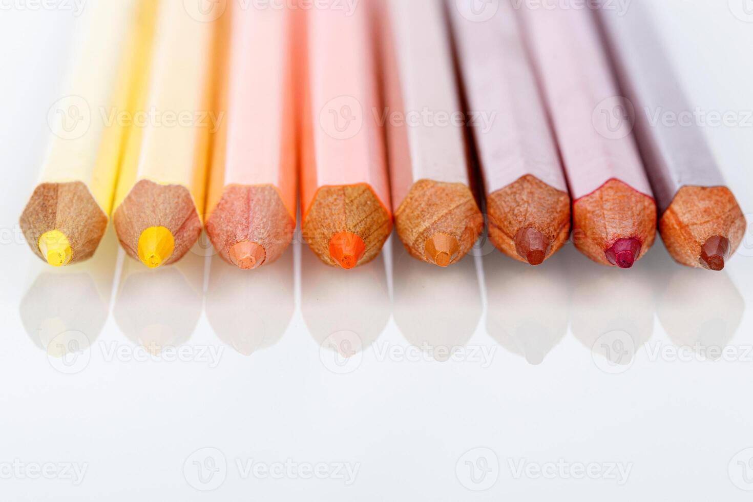 red, pink, yellow pencil on a white background photo