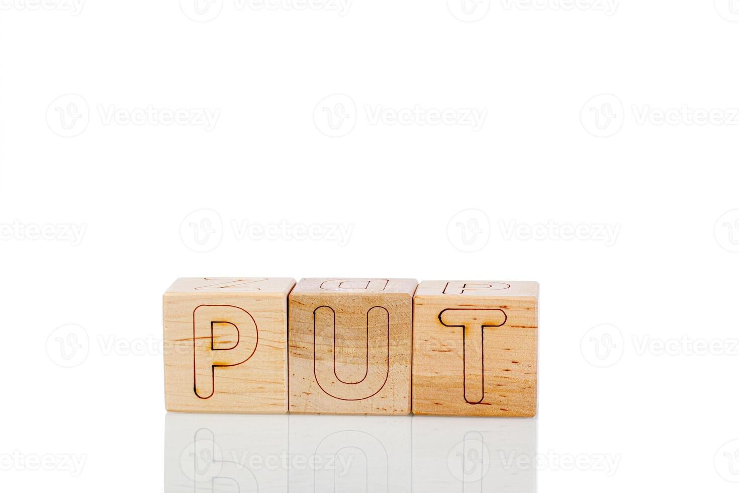 Wooden cubes with letters put on a white background photo