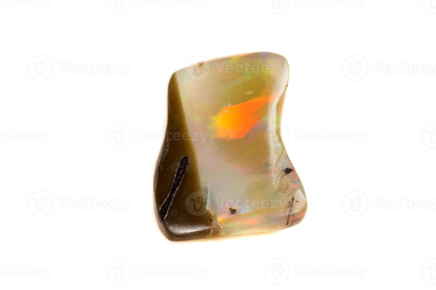 Macro Opal mineral stone in rock on white background photo