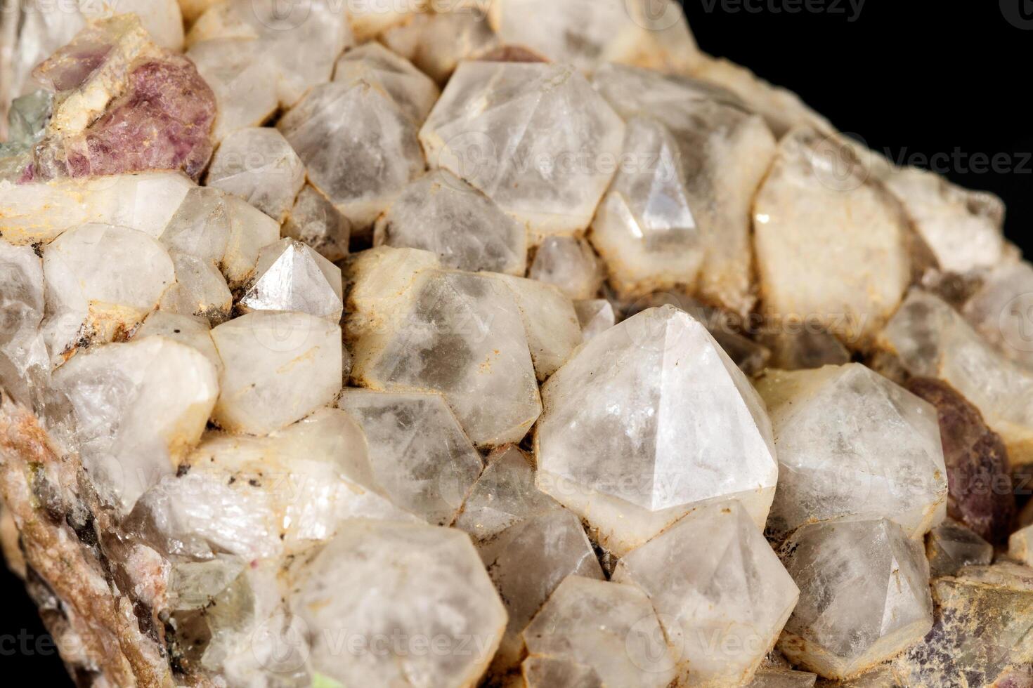 Macro mineral quartz stone with fluorite on granite on a black background photo