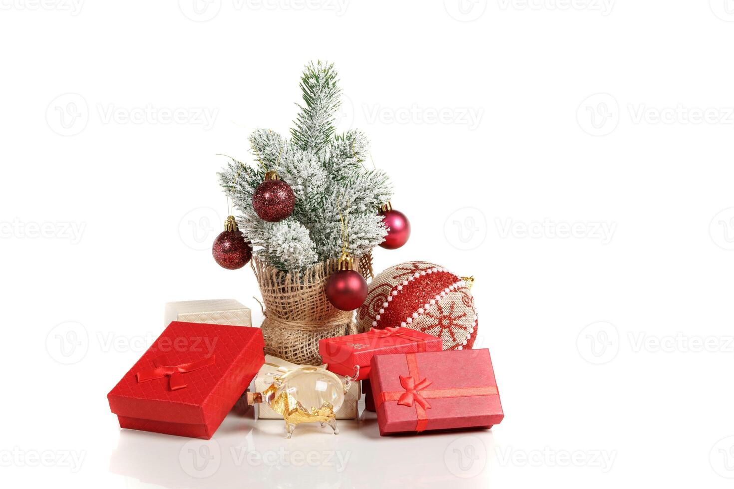 Christmas tree gift boxes with toys on a white background photo