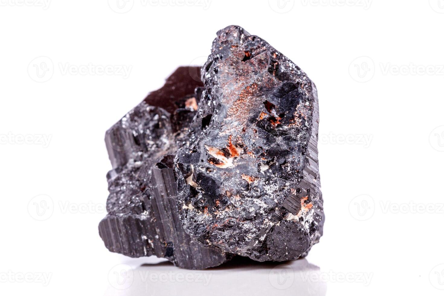 macro mineral stone sherle, schorl, black tourmaline on white background photo