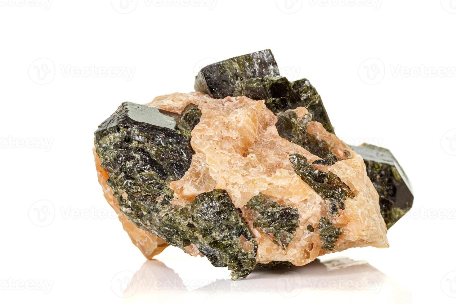 Macro of a mineral stone Vesuvianite on a white background photo