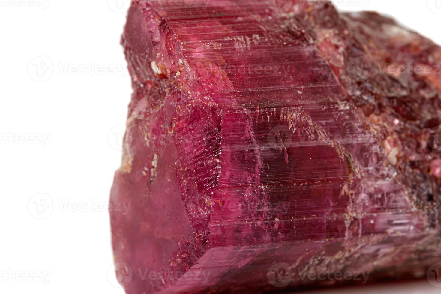 Macro red tourmaline mineral stone on white background photo