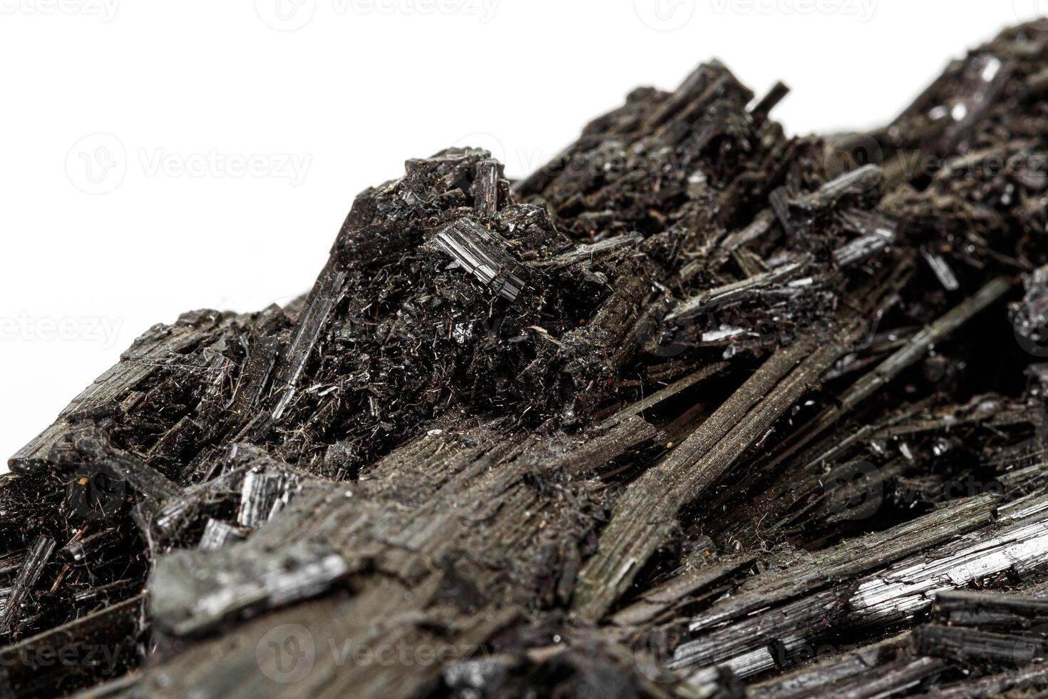 Macro stone black mineral tourmaline Scherl on white background photo