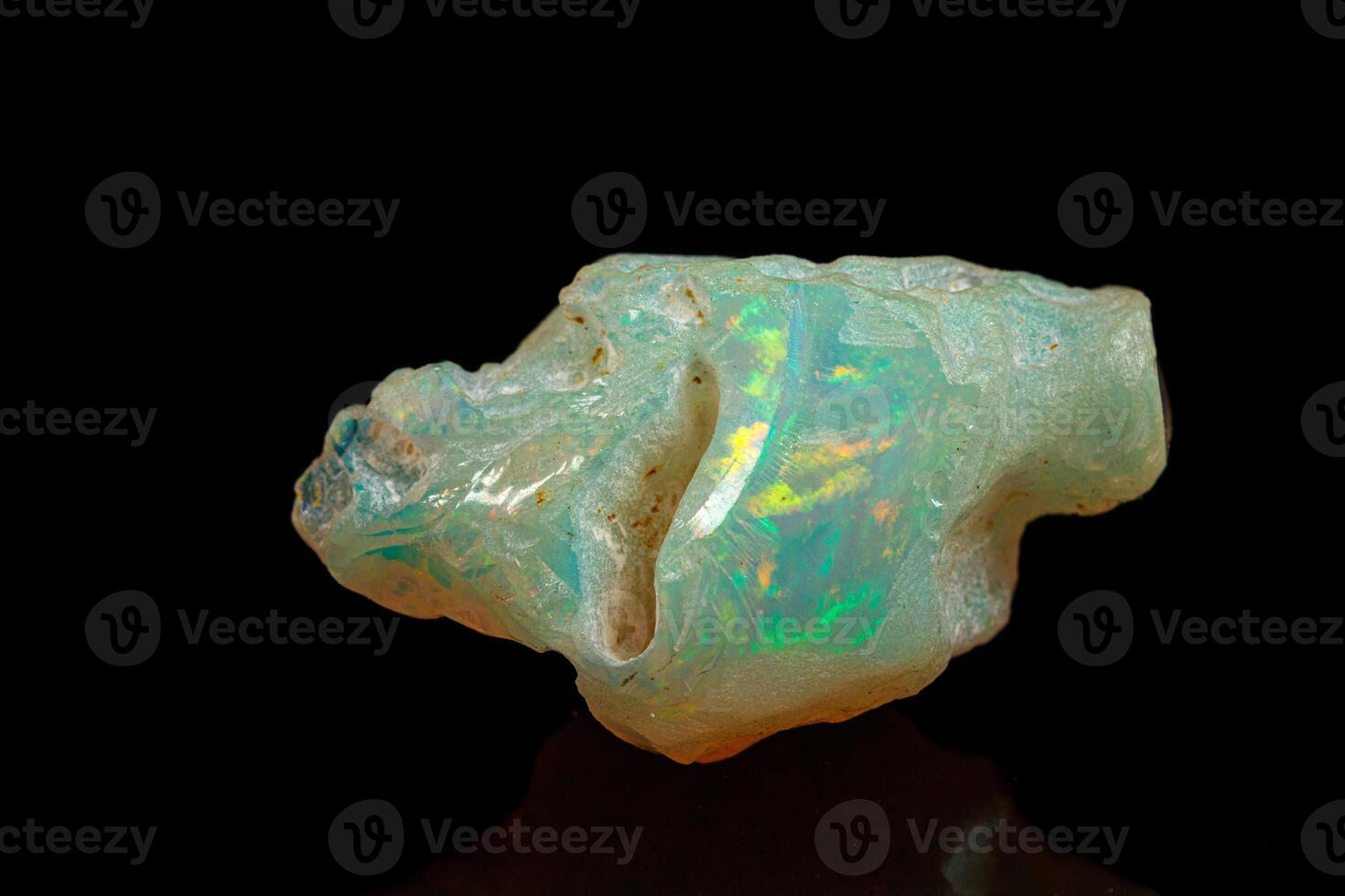 macro mineral stone rare and beautiful opals on a black background photo